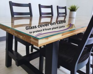 Glass cover on the table to save its surface.